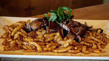 58. Tea Smoked Duck w. Spicy Deep Fried Onion (Spicy)